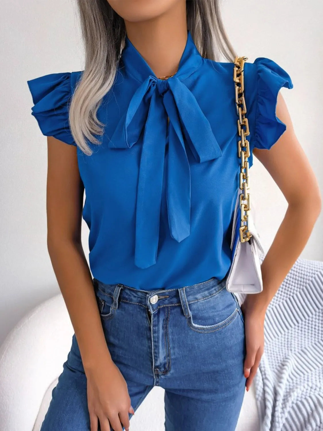 Moa | Elegant blouse with ruffle sleeve and tie band at the front